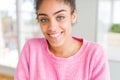 Beautiful young african american woman with afro hair with a happy and cool smile on face Royalty Free Stock Photo