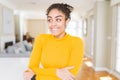 Beautiful young african american woman with afro hair smiling looking side and staring away thinking Royalty Free Stock Photo