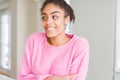 Beautiful young african american woman with afro hair smiling looking side and staring away thinking Royalty Free Stock Photo