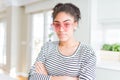 Beautiful young african american woman with afro hair wearing crazy pink heart glasses Relaxed with serious expression on face Royalty Free Stock Photo