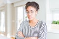 Beautiful young african american woman with afro hair wearing glasses Relaxed with serious expression on face Royalty Free Stock Photo