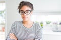 Beautiful young african american woman with afro hair wearing glasses Relaxed with serious expression on face Royalty Free Stock Photo
