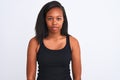 Beautiful young african american woman over isolated background with serious expression on face Royalty Free Stock Photo