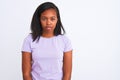 Beautiful young african american woman over isolated background with serious expression on face Royalty Free Stock Photo