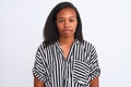 Beautiful young african american woman wearing elegant shirt over isolated background with serious expression on face Royalty Free Stock Photo