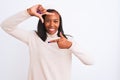 Beautiful young african american woman wearing turtleneck sweater and winter hat smiling making frame with hands and fingers with Royalty Free Stock Photo