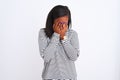 Beautiful young african american woman wearing winter sweater over isolated background with sad expression covering face with Royalty Free Stock Photo