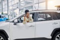 Young african woman fulfilled her dream, bought a car