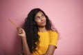 Beautiful African woman holding a pencil and thinking of something Royalty Free Stock Photo