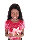 African woman holding pink lily Royalty Free Stock Photo