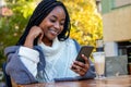 Beautiful young Afro American girl relaxing in a coffee shop. Royalty Free Stock Photo