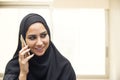 Beautiful young arabian woman talking on cell phone Royalty Free Stock Photo