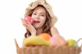 Beautiful young Asia woman holding apple and smile after make up on white background. Close up facial make up. Many fruit