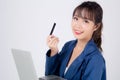 Beautiful young asian business woman happy holding credit card and laptop computer Royalty Free Stock Photo