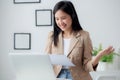 Beautiful young asian business woman using laptop computer working from home for video conference online. Royalty Free Stock Photo