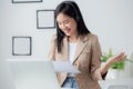 Beautiful young asian business woman using laptop computer working from home for video conference online. Royalty Free Stock Photo