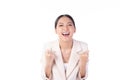 Beautiful young Asian business woman wearing suit feeling successful, good job, happy and smile celebrating with arms up isolated Royalty Free Stock Photo