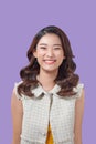 Beautiful young asian colorful stand and pose with big smile happy beaming face on purple ackground