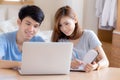 Beautiful young asian couple calculate expenses finance with laptop and planning together