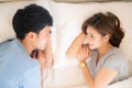 Beautiful young asian couple love looking eyes together on bed in the bedroom Royalty Free Stock Photo