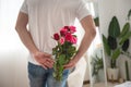 Beautiful young asian couple with man hiding red rose flower for surprise at home  husband and wife with happy valentine or Royalty Free Stock Photo