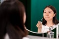 Woman looking herself on mirror Royalty Free Stock Photo