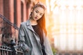 Beautiful young Asian fashion model woman walking out from home in big city at sunny day. Royalty Free Stock Photo