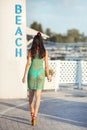 Young asian female enjoying sunny day on tropical beach Royalty Free Stock Photo