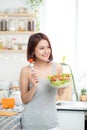 Beautiful young asian girl eating salad. smiling happy girl eating healthy food. Royalty Free Stock Photo