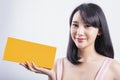 Beautiful young asian girl presenting your product Royalty Free Stock Photo