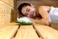 Beautiful Young asian girl sleeping relax, lying in sauna cabin Royalty Free Stock Photo