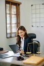 beautiful young asian lawyer woman sitting working in the office