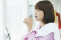 Beautiful young asian thai black short hair woman brushing teeth with tooth brush in restroom Royalty Free Stock Photo