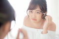 Beautiful young asian woman applying makeup eyebrows brush, beauty asia girl using cosmetic for make up style looking mirror Royalty Free Stock Photo