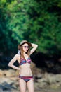 Beautiful Young Asian woman in bikini relaxing on the beach,Travel summer vacation concept. Royalty Free Stock Photo