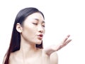 Beautiful young asian woman blowing a kiss Royalty Free Stock Photo