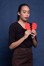 Beautiful young Asian woman with broken heart Royalty Free Stock Photo