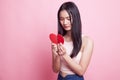 Beautiful young Asian woman with broken heart. Royalty Free Stock Photo