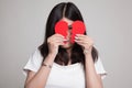 Beautiful young Asian woman with broken heart. Royalty Free Stock Photo