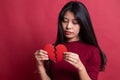 Beautiful young Asian woman with broken heart Royalty Free Stock Photo