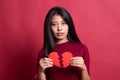 Beautiful young Asian woman with broken heart Royalty Free Stock Photo