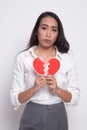 Beautiful young Asian woman with broken heart Royalty Free Stock Photo