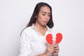 Beautiful young Asian woman with broken heart Royalty Free Stock Photo