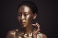 Beautiful young asian woman with bronze paint