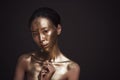 Beautiful young asian woman with bronze paint