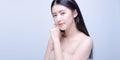 Beautiful Young asian Woman with Clean Fresh Skin look at camera. Girl beauty face care. Facial treatment. Cosmetology, beauty and