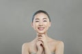 Beautiful young asian woman with clean fresh skin smiling on white background. Face care, Facial treatment, Cosmetology, beauty Royalty Free Stock Photo