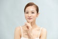 Beautiful Young Asian Woman with Clean Fresh Skin is touching her face, Facial treatment, Cosmetology, beauty and spa Royalty Free Stock Photo