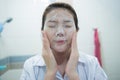 Beautiful young asian woman cleaning face skin Royalty Free Stock Photo