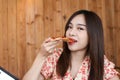 Beautiful Young asian woman eating delicious or yummy pizza